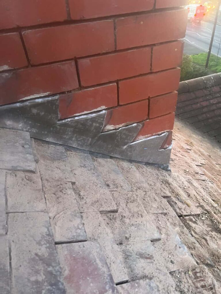This is a photo of new leadwork being installed around an old chimney. Works carried out by TRP Roofing Hornsea